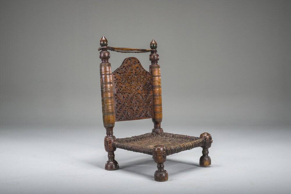 Early 20th century handmade low cedar chair, Nuristan, 1890s