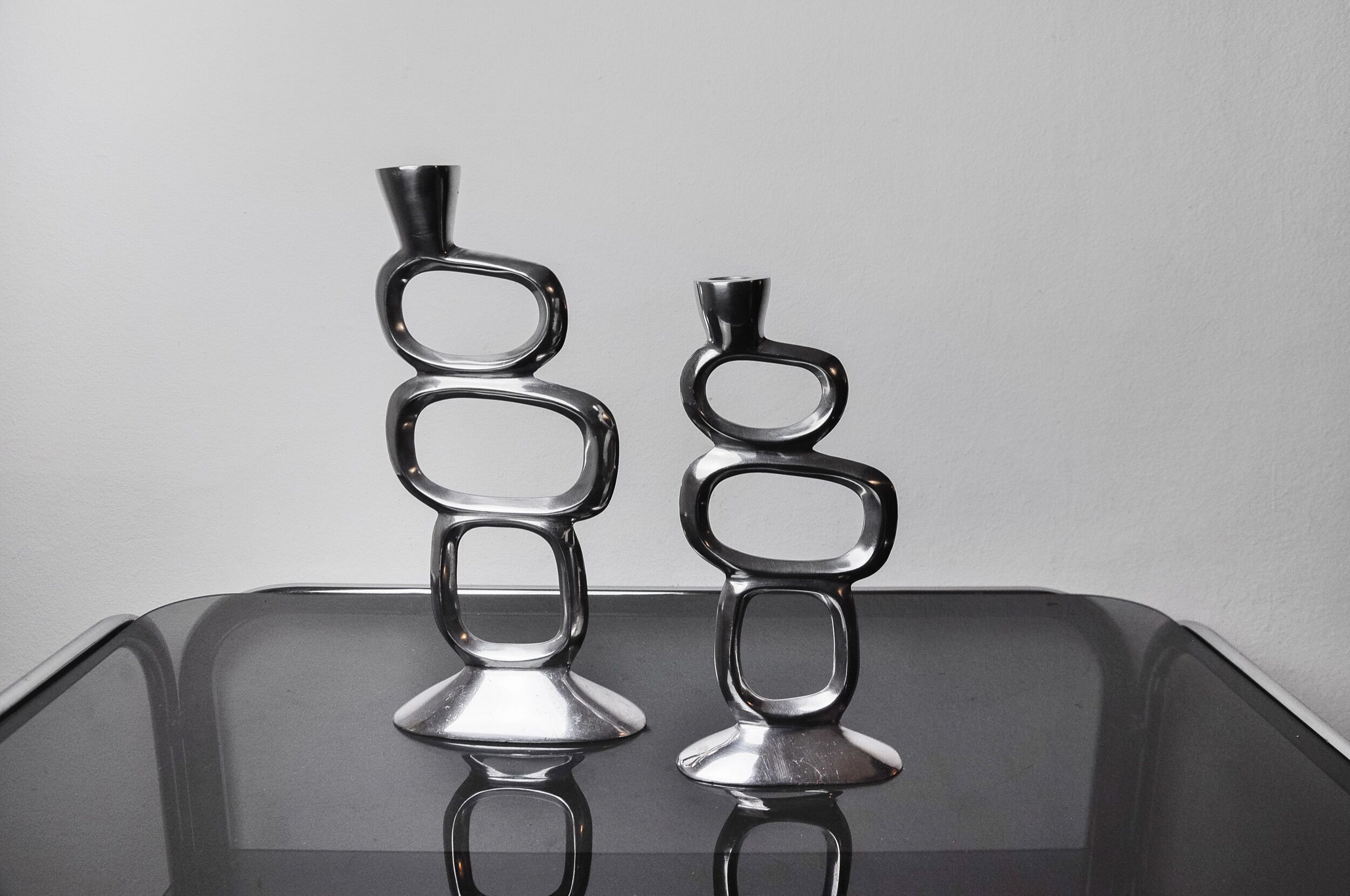 Pair of circle candlesticks by Matthew Hilton, England, 1980