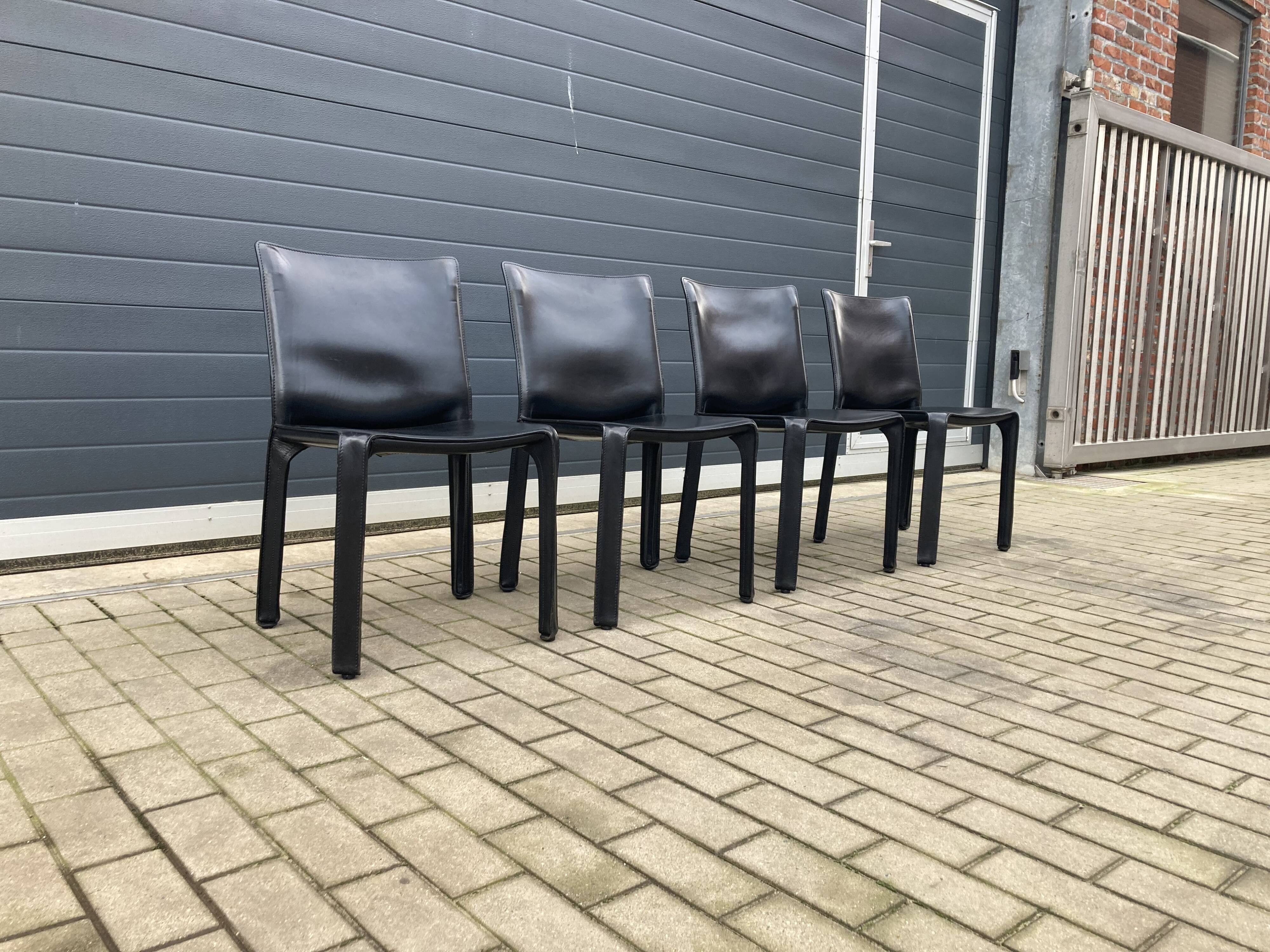 4 black Cassina Cab chairs by Mario Bellini