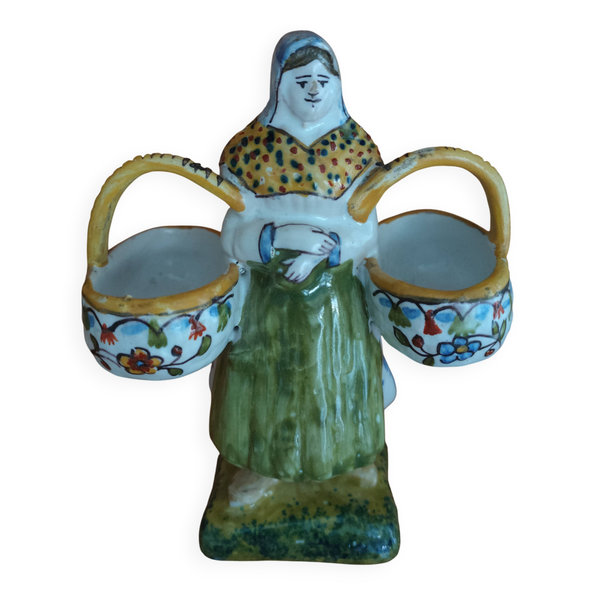 Antique earthenware salt cellar with a woman with baskets