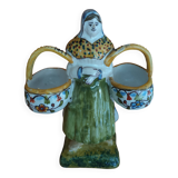 Antique earthenware salt cellar with a woman with baskets