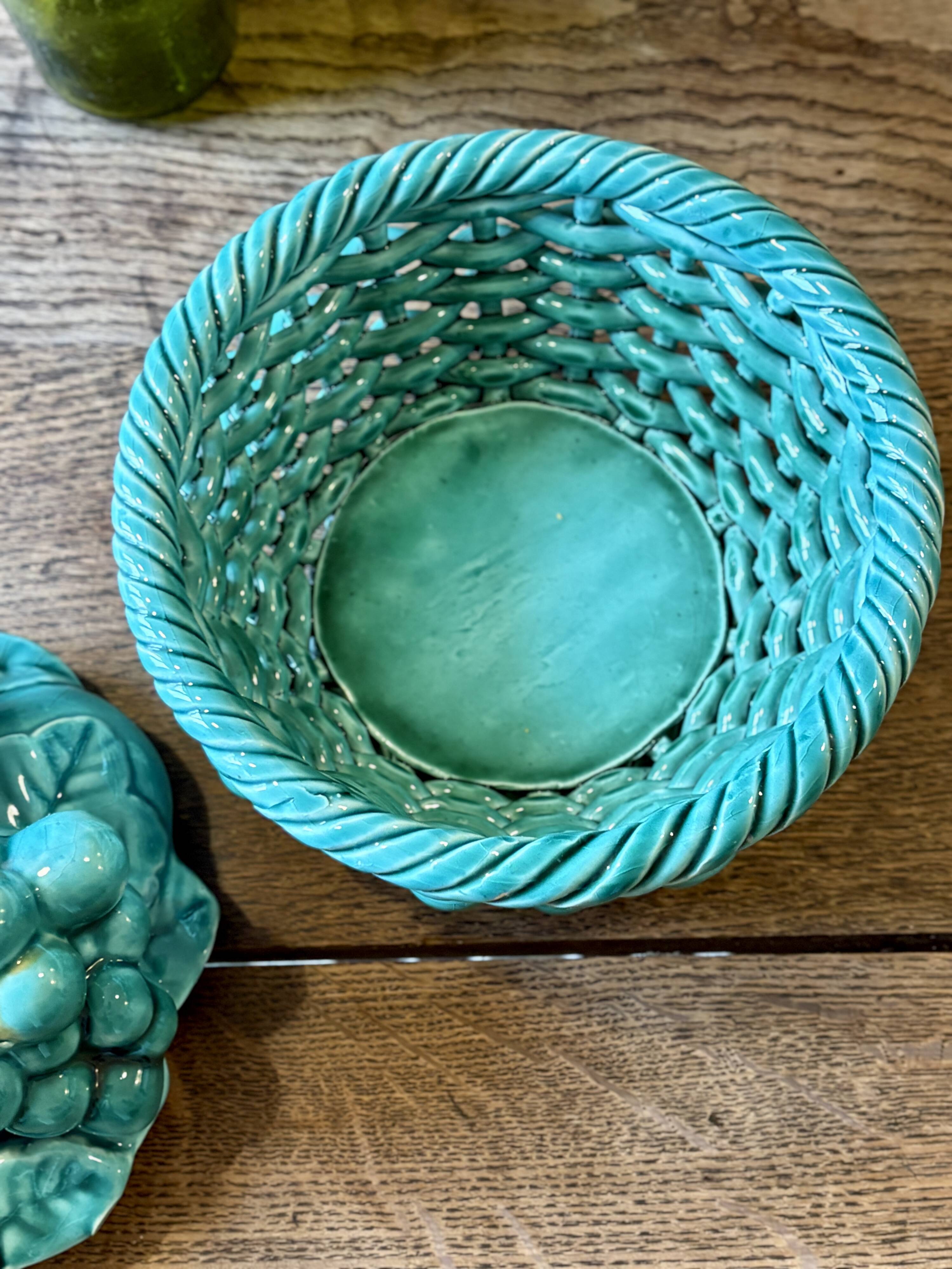 Vintage green earthenware plate/basket with fruit decorations.