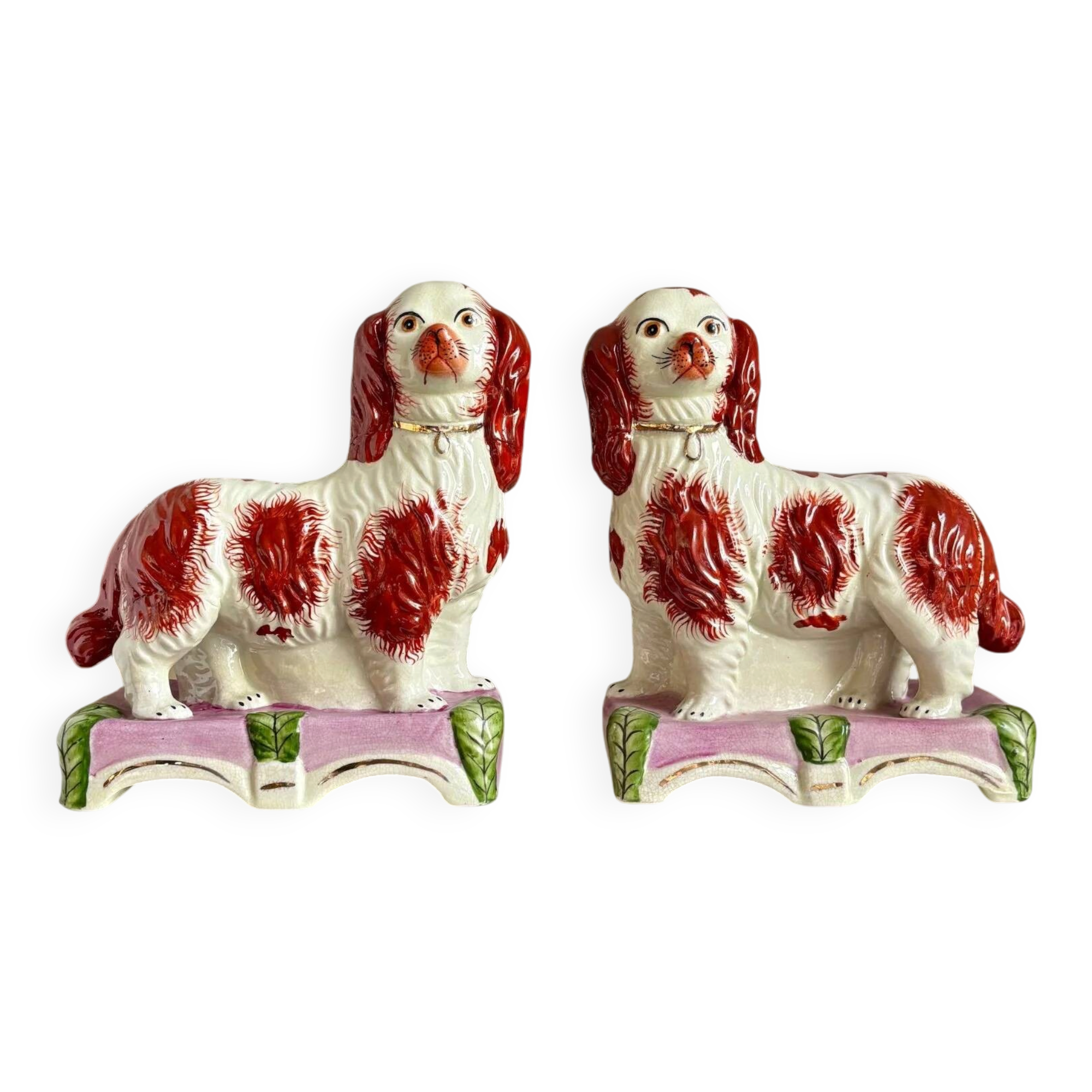 Pair of Staffordshire porcelain Cavalier King Charles dogs on terrace, 19th century.