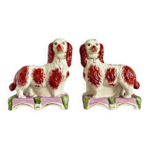 Pair of Staffordshire porcelain Cavalier King Charles dogs on terrace, 19th century.