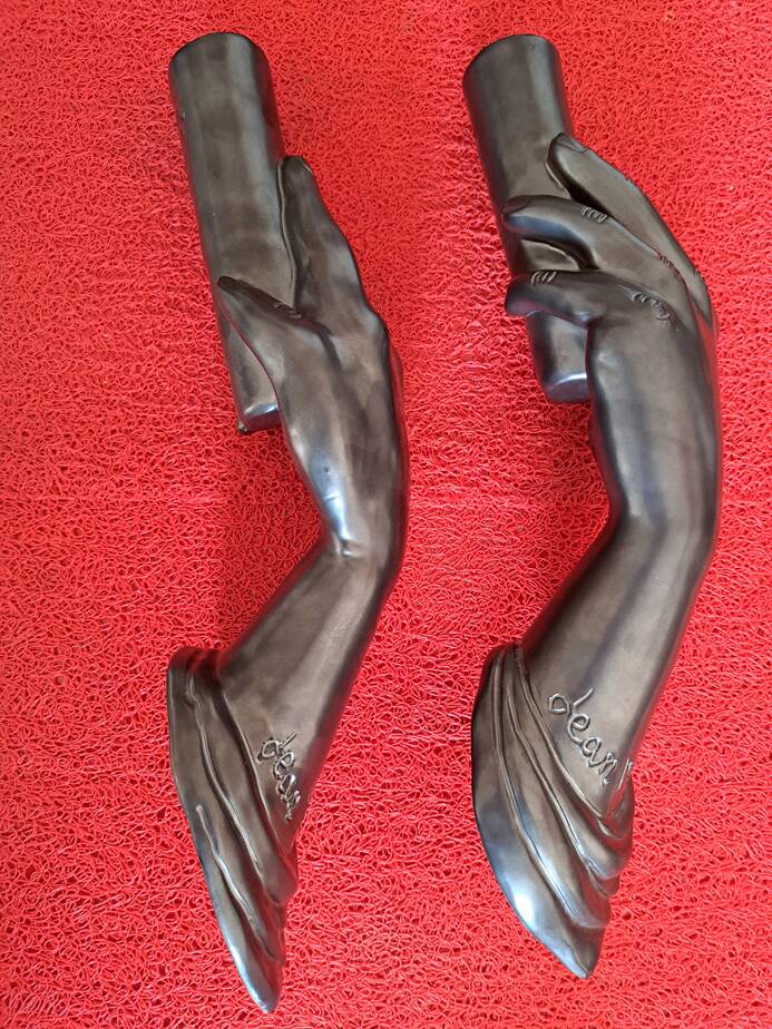 Pair of sculptural ceramic wall lights by Jean Marais