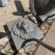 Two lion head wall sconces in tin.