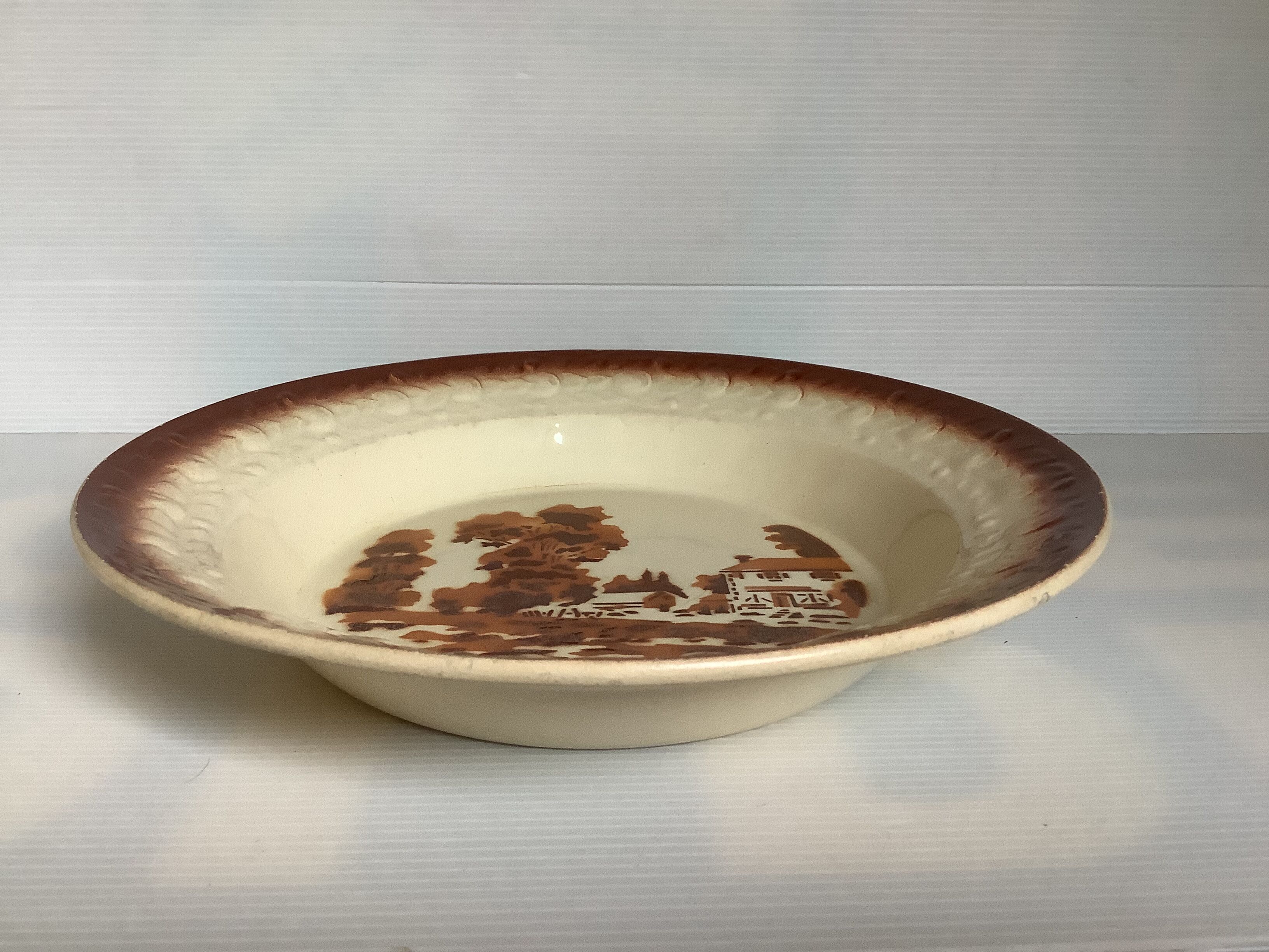 Earthenware plate from Moulin des Loups with stencil pattern.