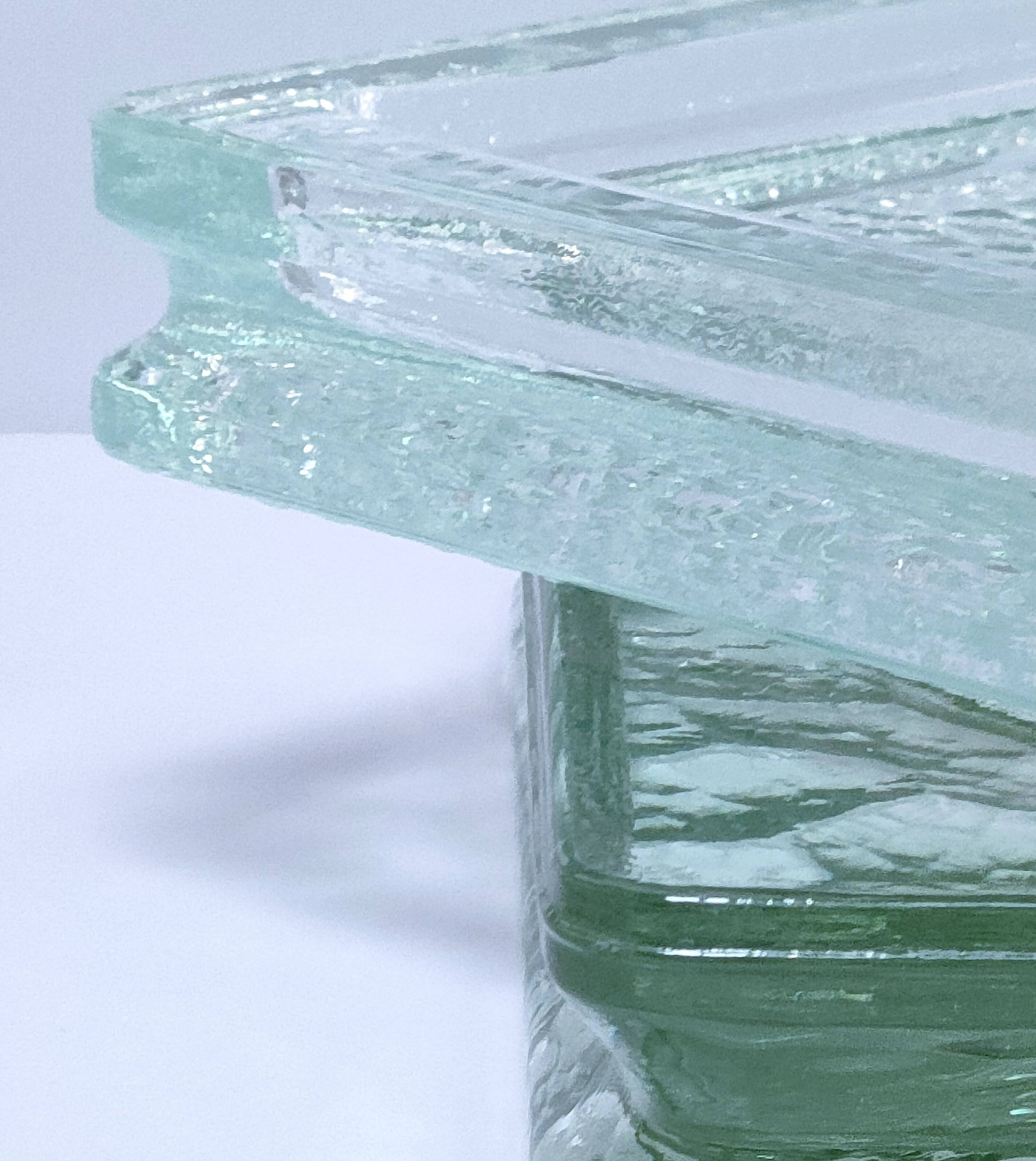 Two designer glass paving pockets