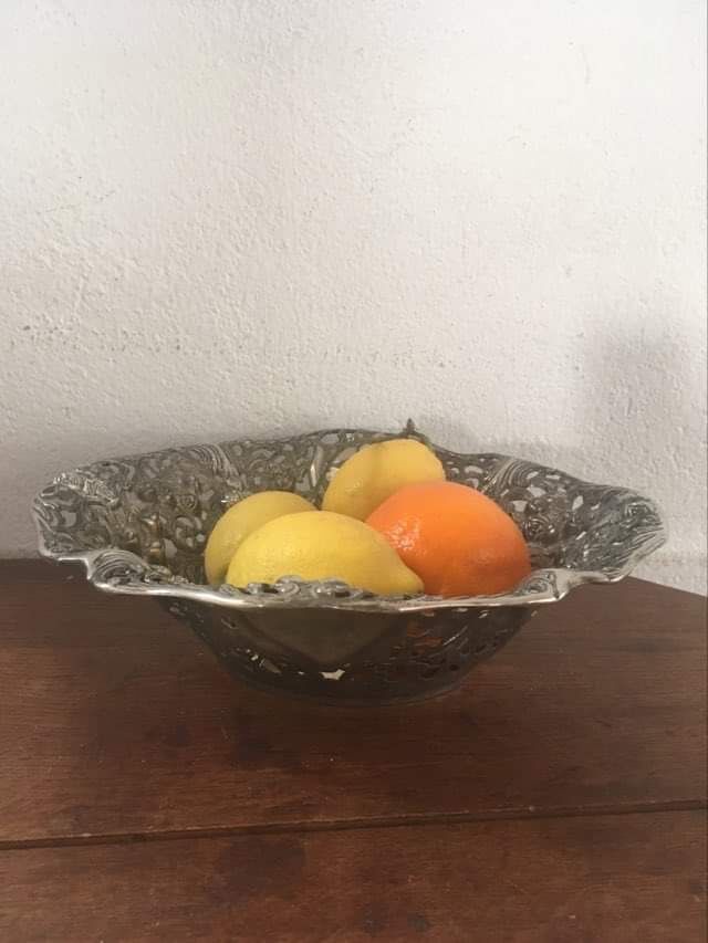 Silver metal basket with floral decoration