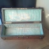 Old studded wooden box adorned with flat iron