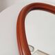 Vintage oval wooden mirror "caramel" from the 1960s.