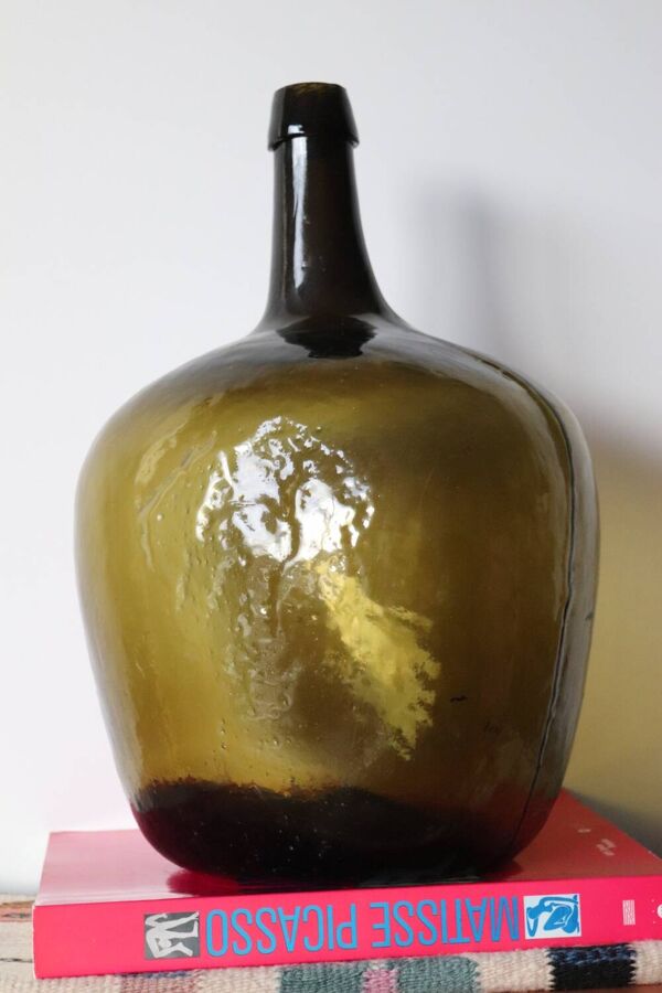 Dame jeanne ancienne en verre martelé