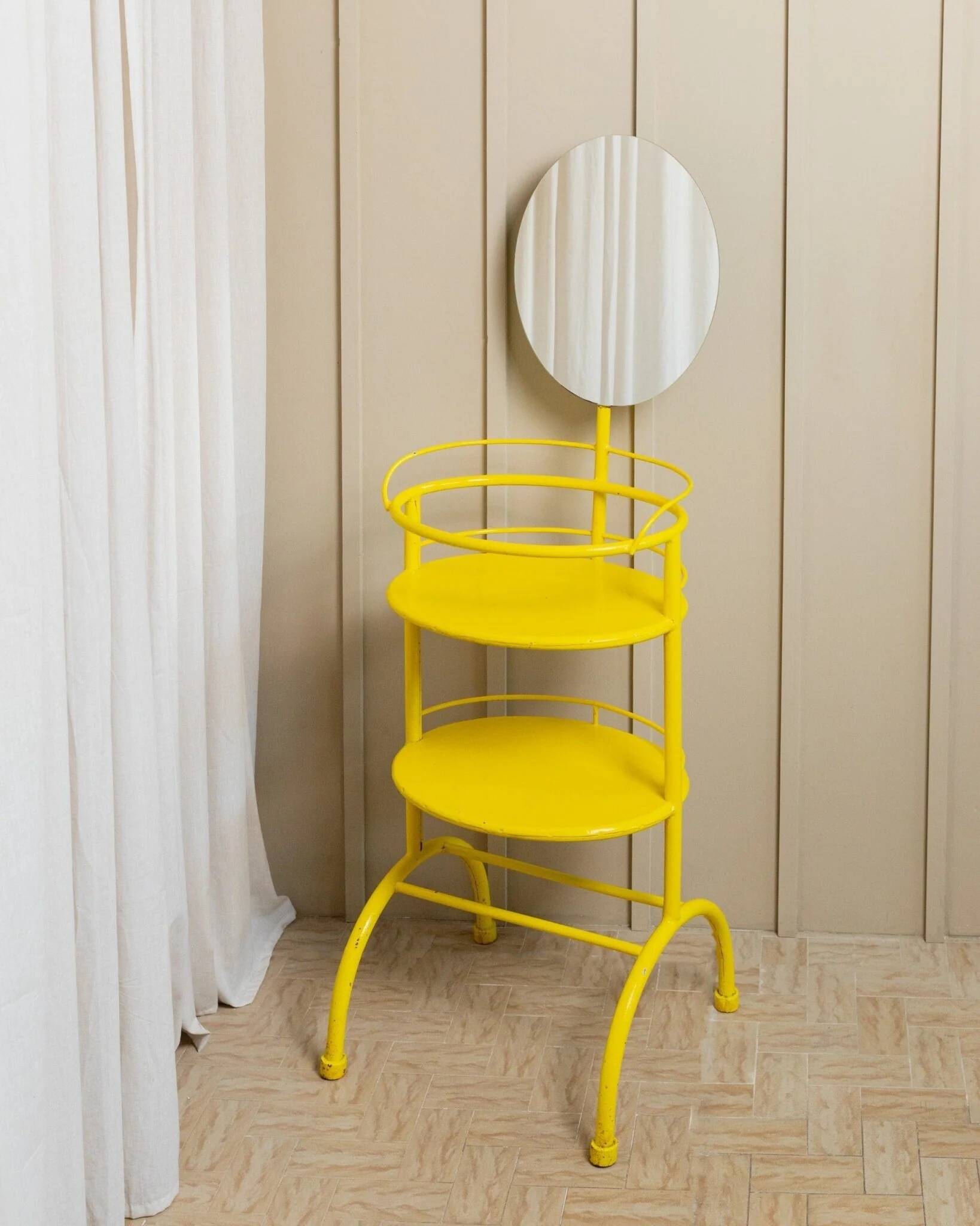 Yellow metal side table with swiveling oval mirror and two tray shelves, vintage 1960s Italy