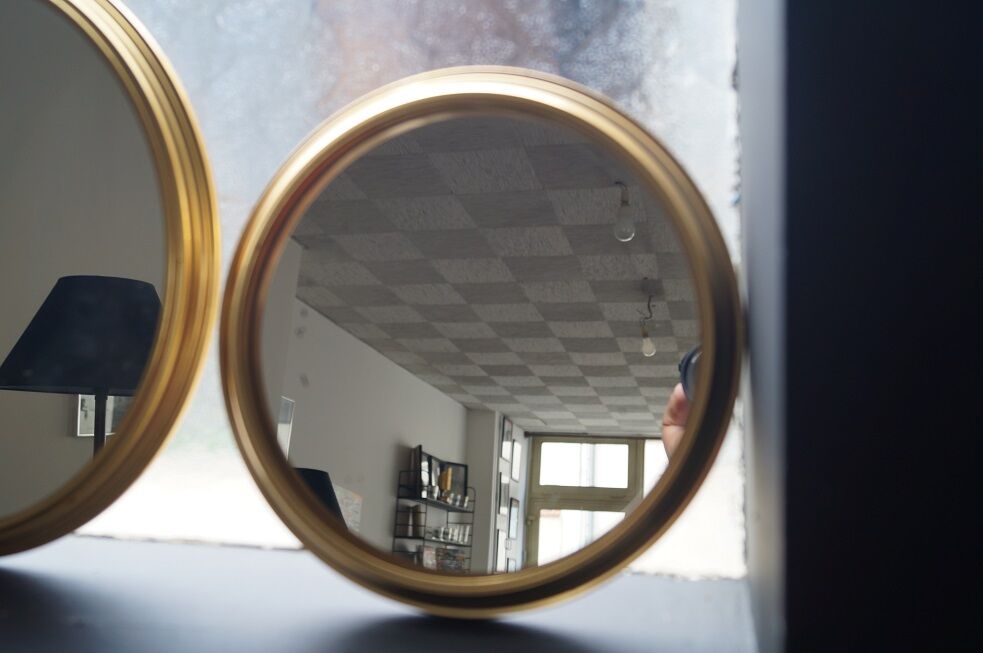 Suite of three brass mirrors