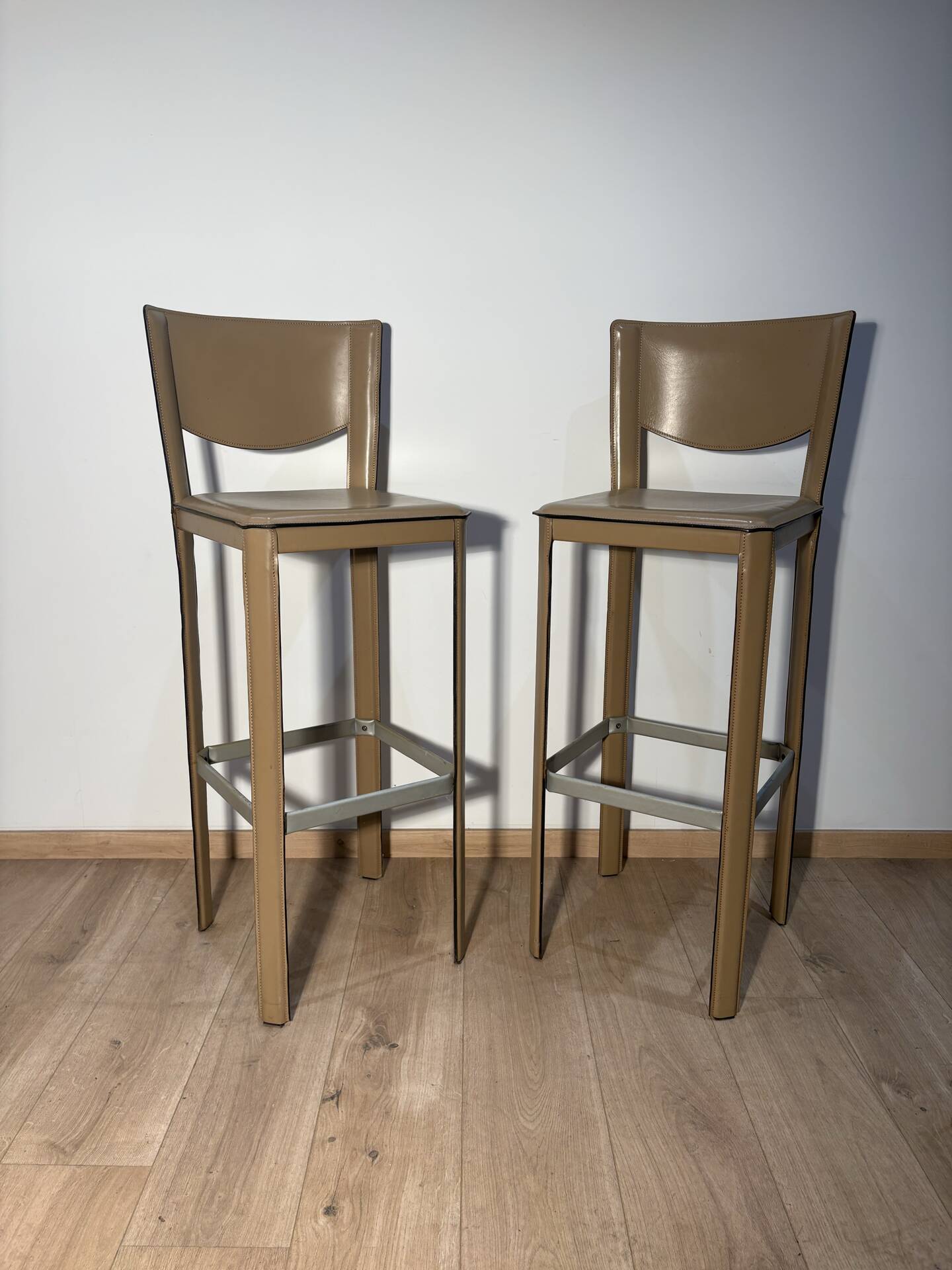 Pair of leather stools Enrico Pellizoni
