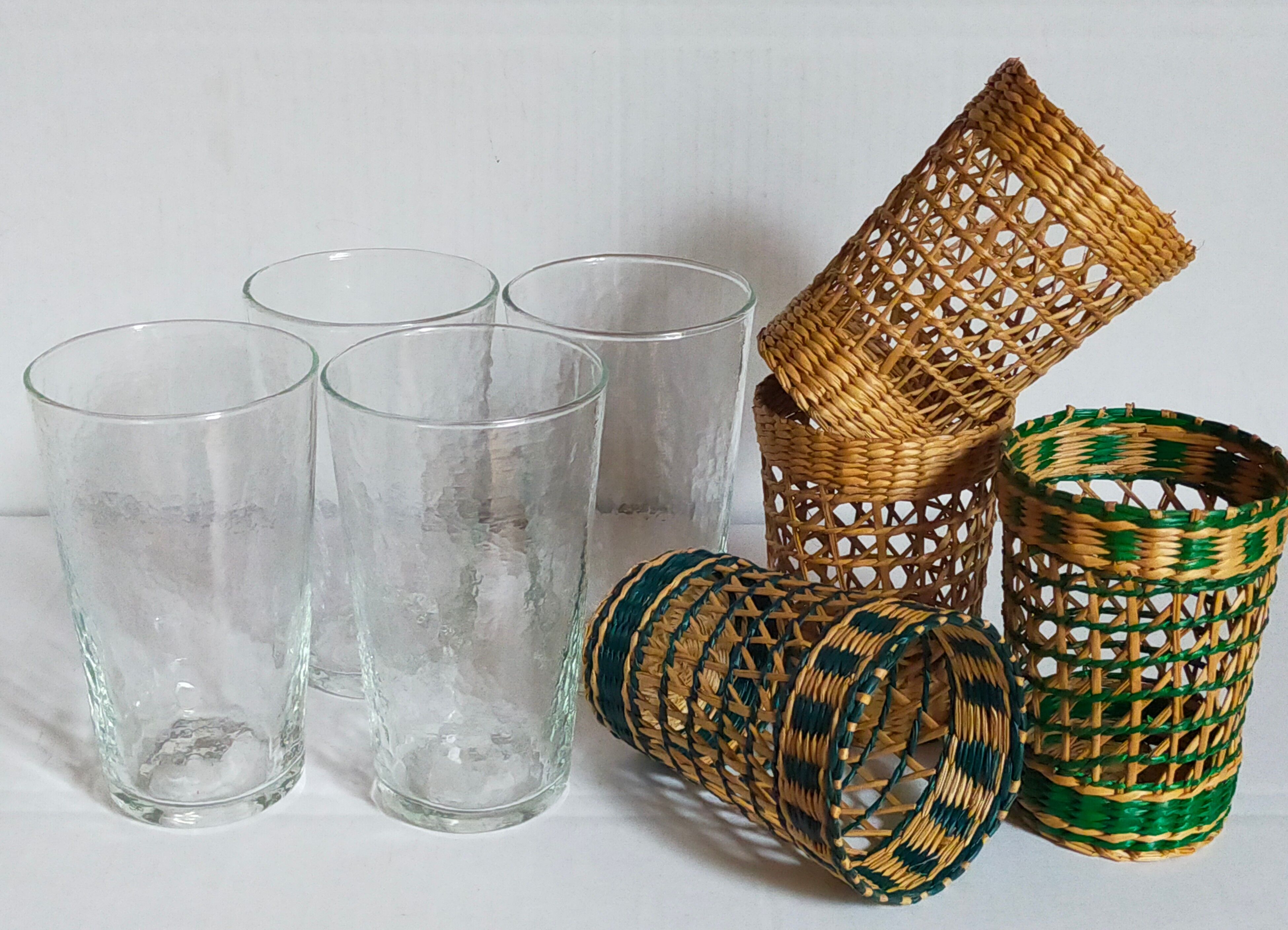Four long drink glasses in vintage woven rattan cases