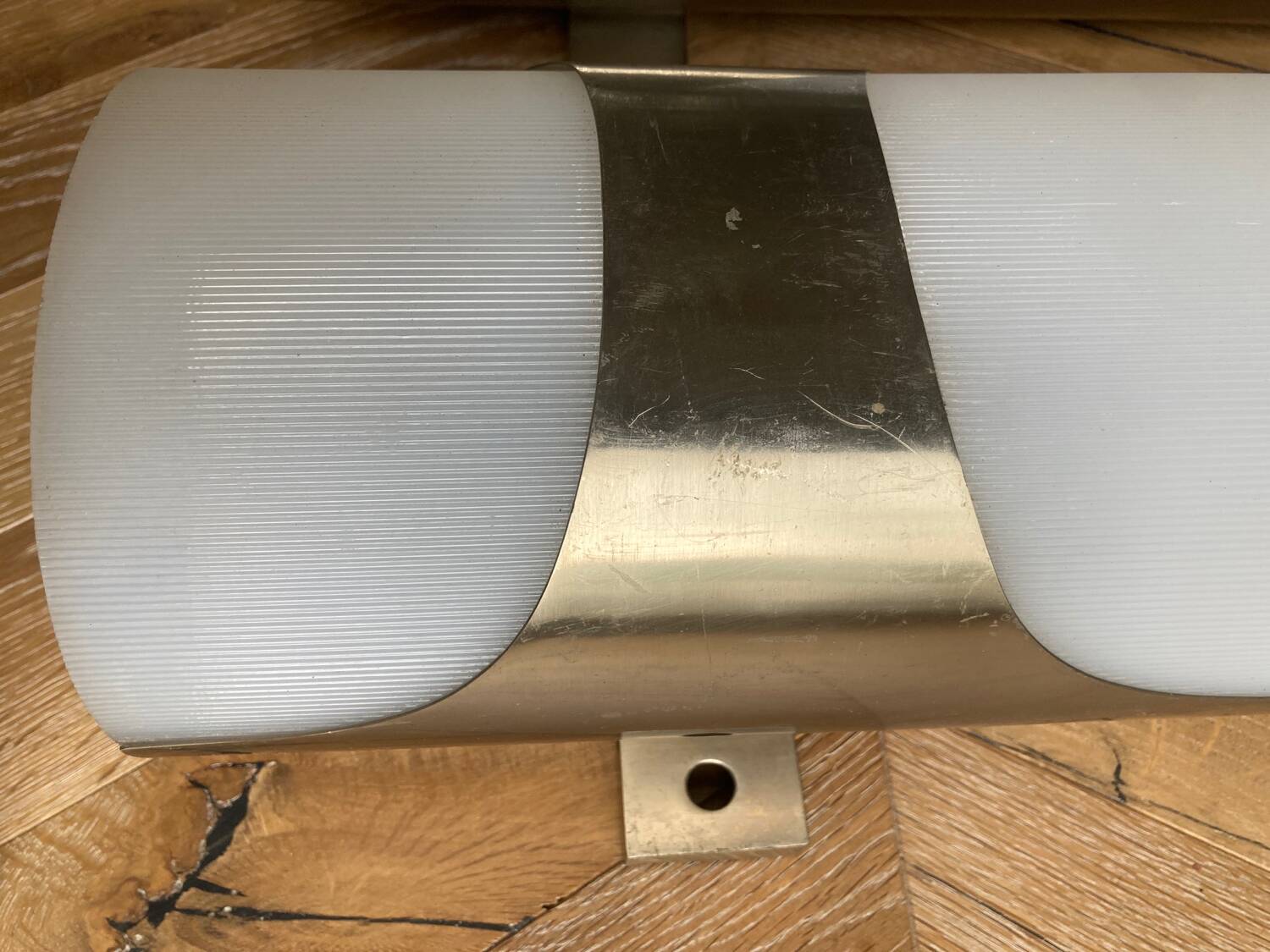 Brushed metal and ribbed opal plastic wall lights