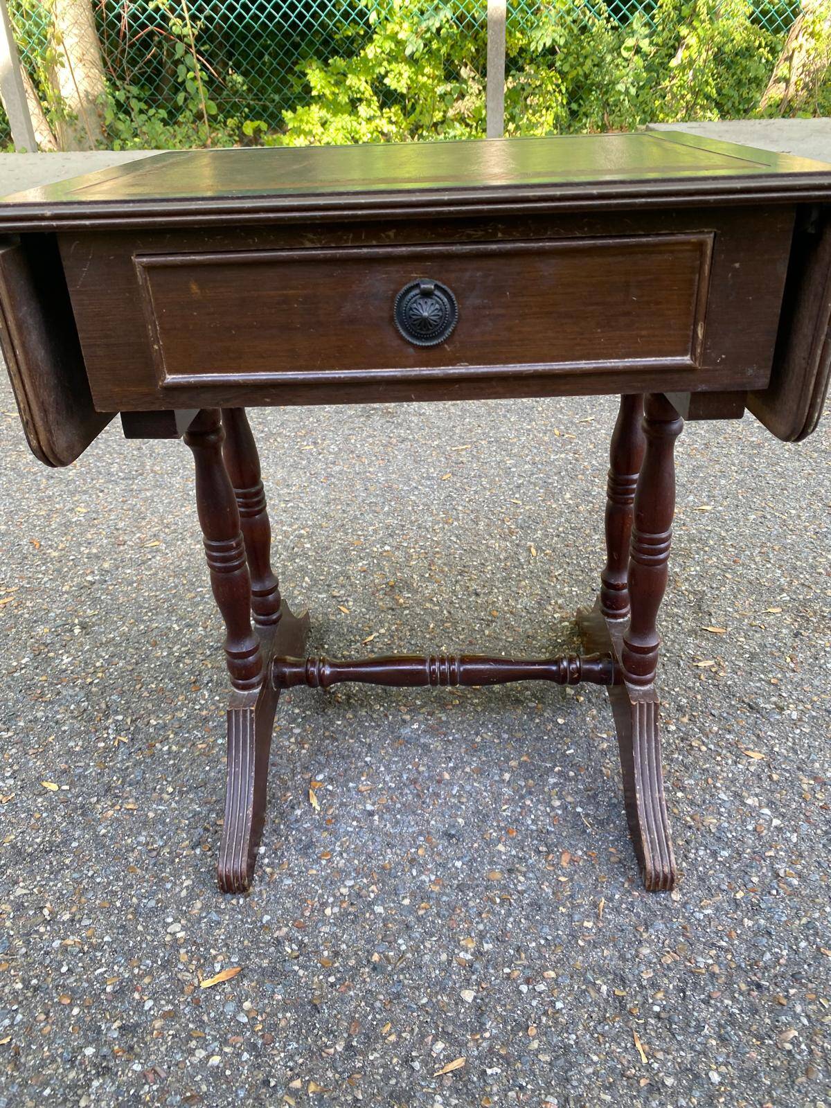 Small drop-leaf side table in English style with leather top & drawer.
