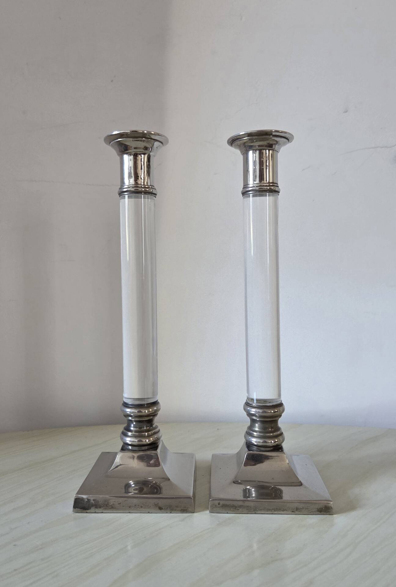 Pair of lucite and silver-plated candlesticks