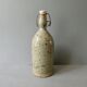 Sandstone bottle signed Guy Baudat, 70s