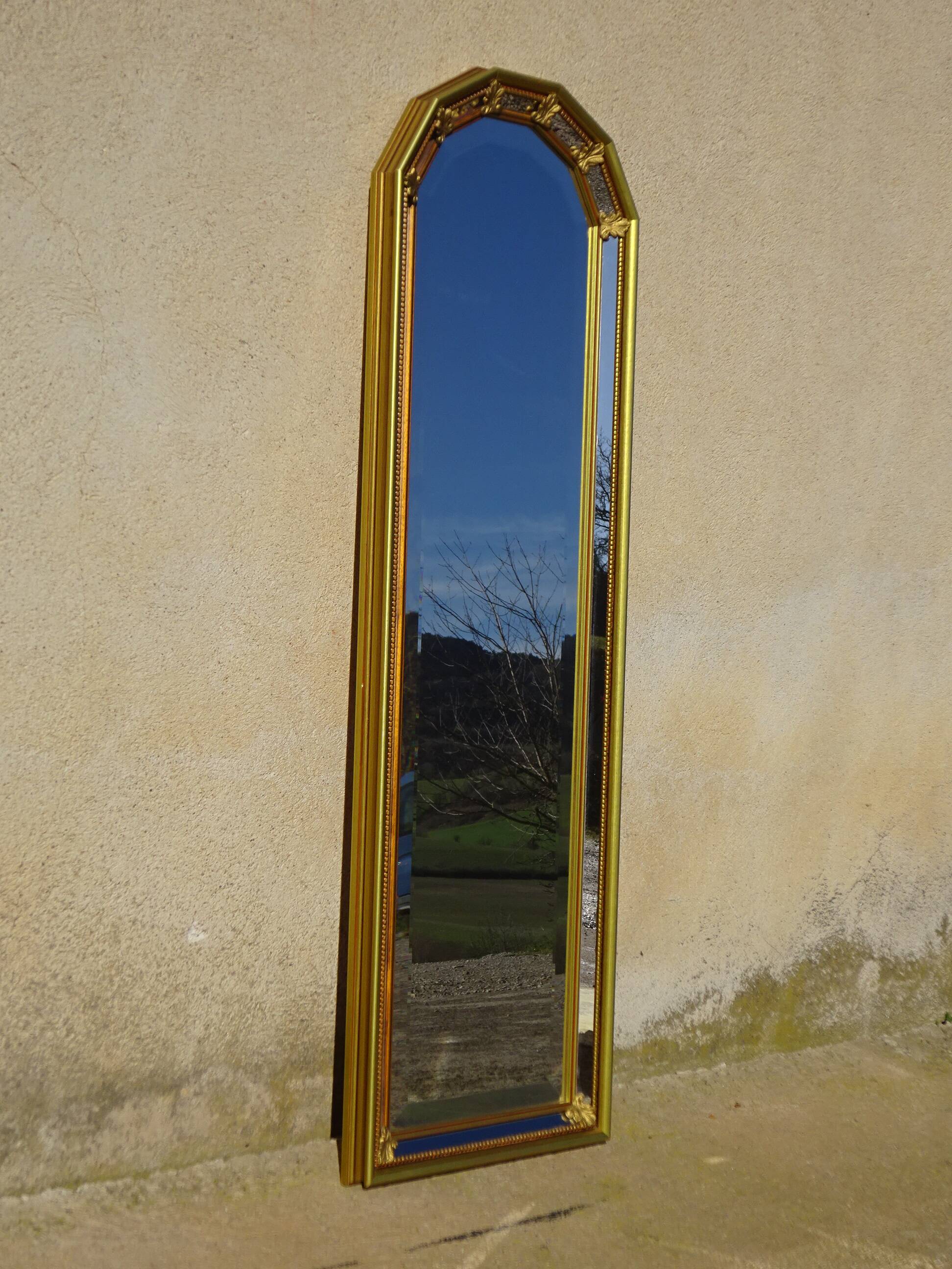 Hall mirror, gilded frame with fillets and fleur-de-lis.