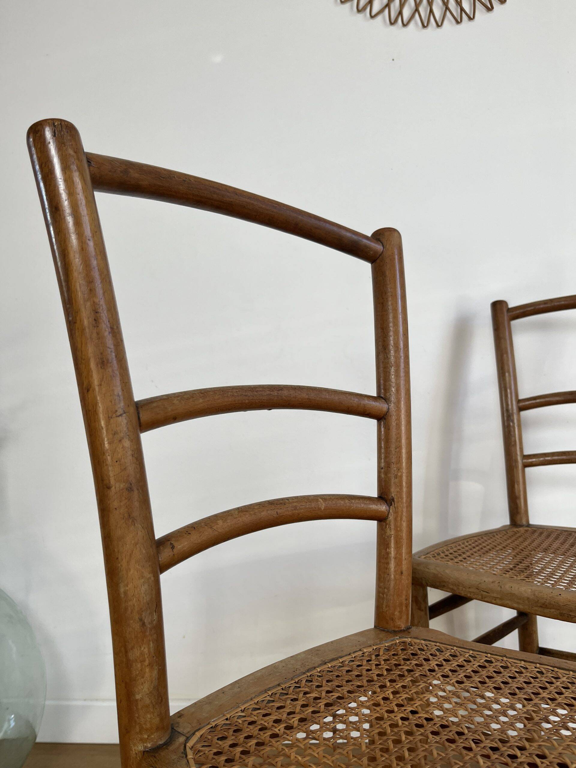 Pair of caned bistro chairs