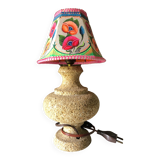 Sandstone foot accent lamp surmounted by a painted lampshade