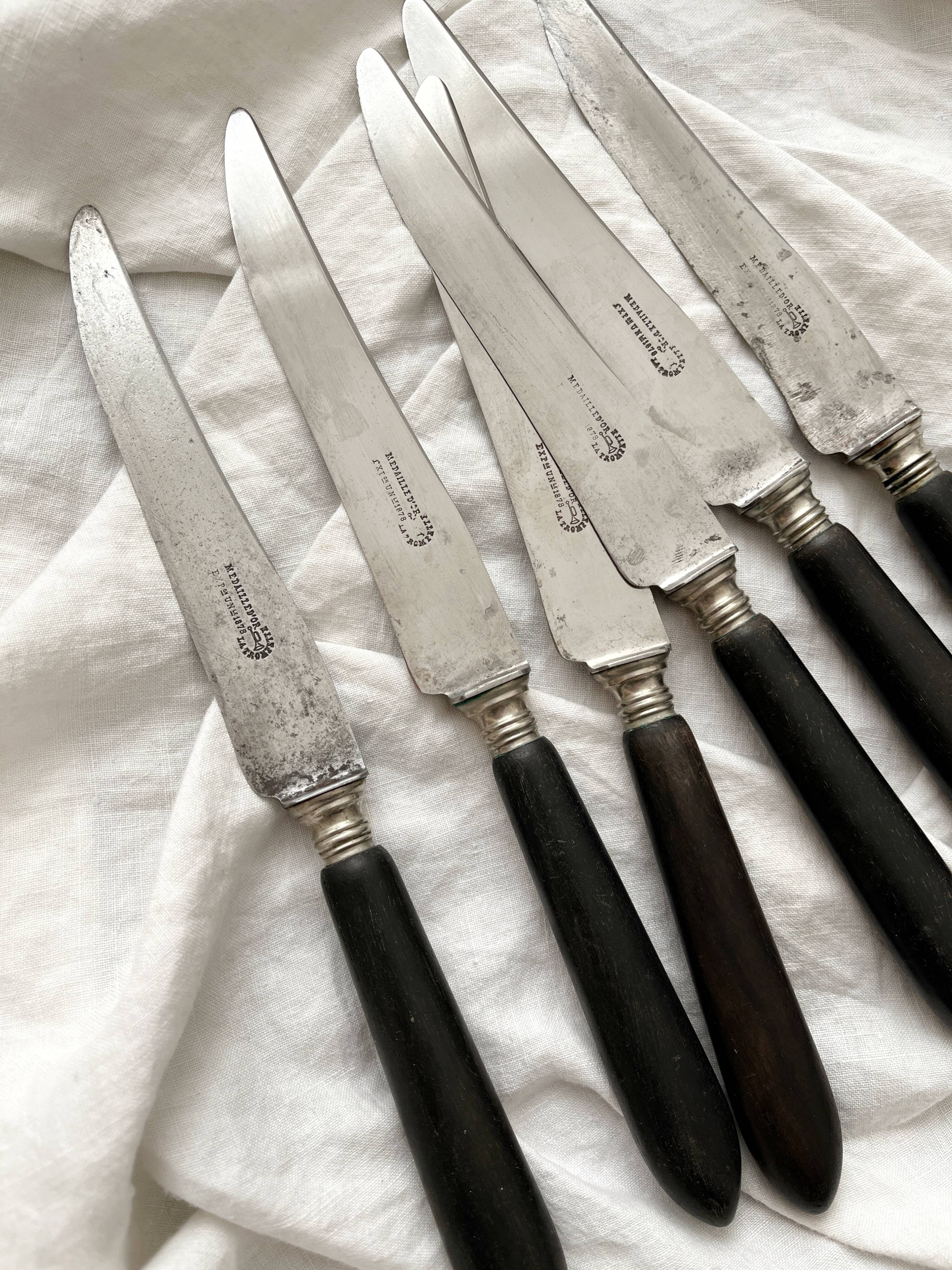 6 antique black wooden table knives La Trompette, late 19th century