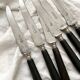 6 antique black wooden table knives La Trompette, late 19th century