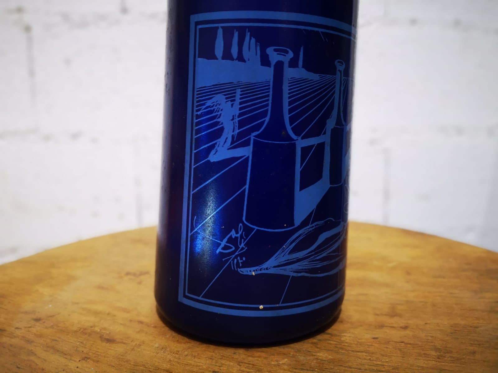Surreal blue glass bottle, designed by Salvador Dali