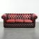 Canapé chesterfield 2,5/3 places en cuir de vachette rouge.