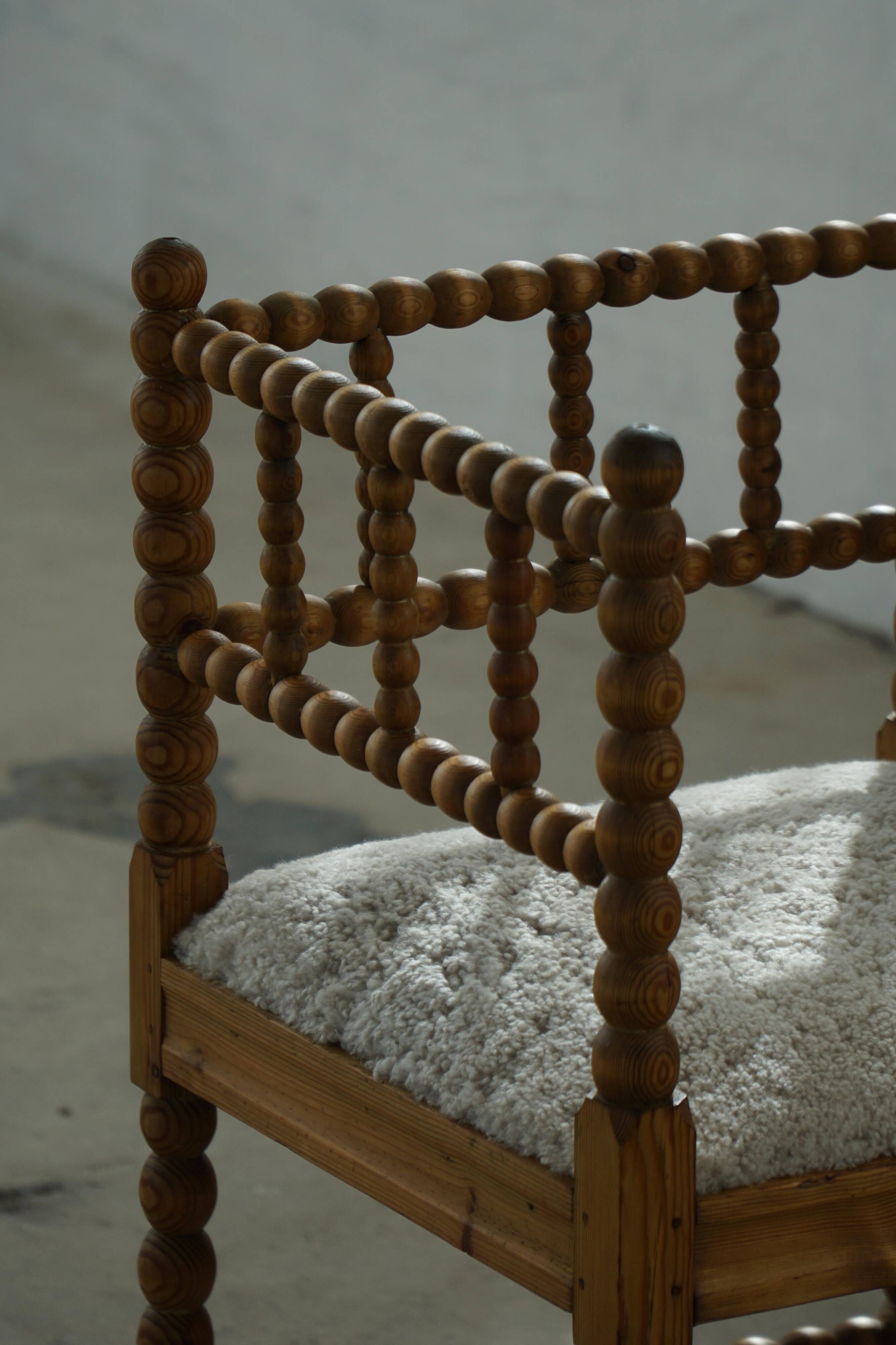 Antique French corner chair handcrafted with lamb's wool, early 20th century.
