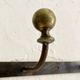 Wall-mounted coat rack with 4 hooks in metal and brass