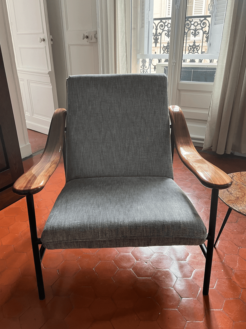 Armchair with walnut armrest