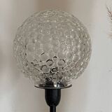 Table lamp with an antique textured glass globe