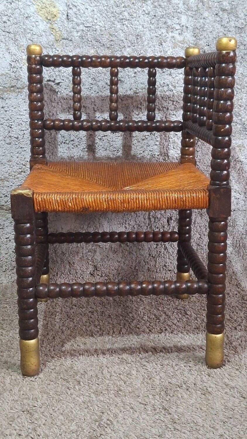 Fireplace corner chair in Louis XIII style, turned wood with braided rush, 19th century.