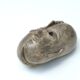 Patinated plaster sculpture paper press: Inverted faces