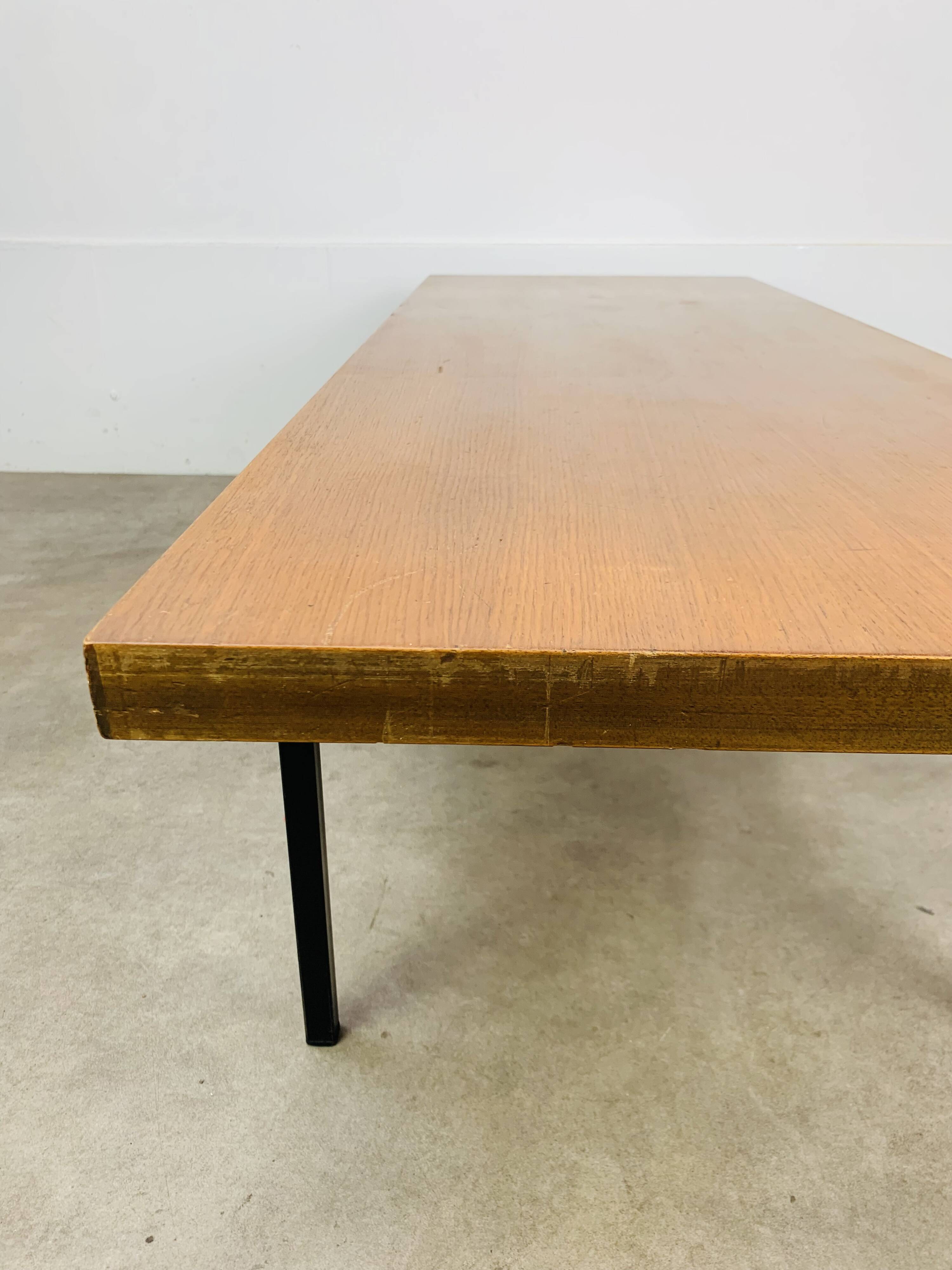 1950s modernist coffee table, wood and black metal.