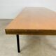 1950s modernist coffee table, wood and black metal.