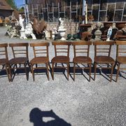 7 curved wooden bistro chairs by Baumann