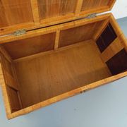 Vintage trunk in wood, rattan, caning, and brass.