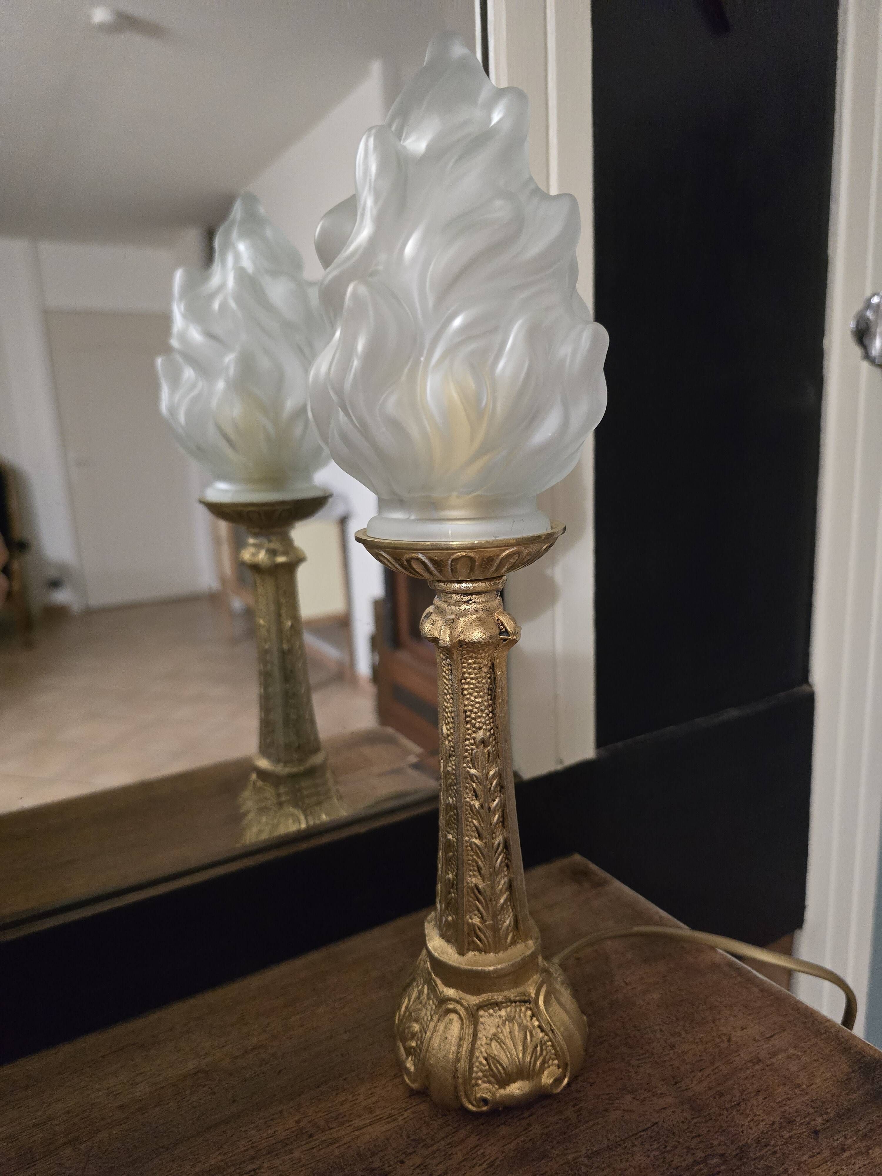 Table lamp with brass base and vintage flame globe