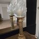 Table lamp with brass base and vintage flame globe