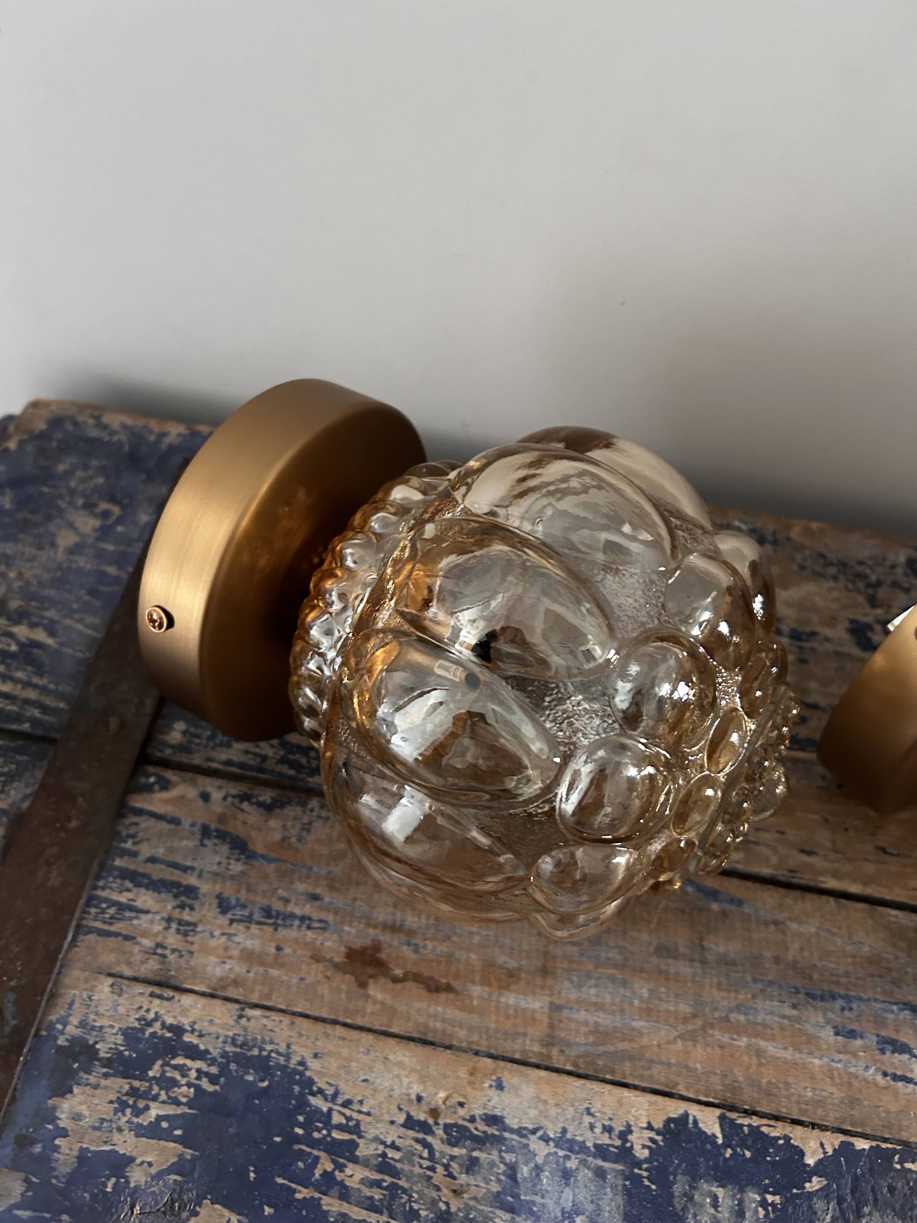 Pair of Scandinavian golden globe wall lights
