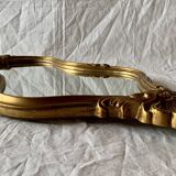 Large rococo mirror in gilded wood