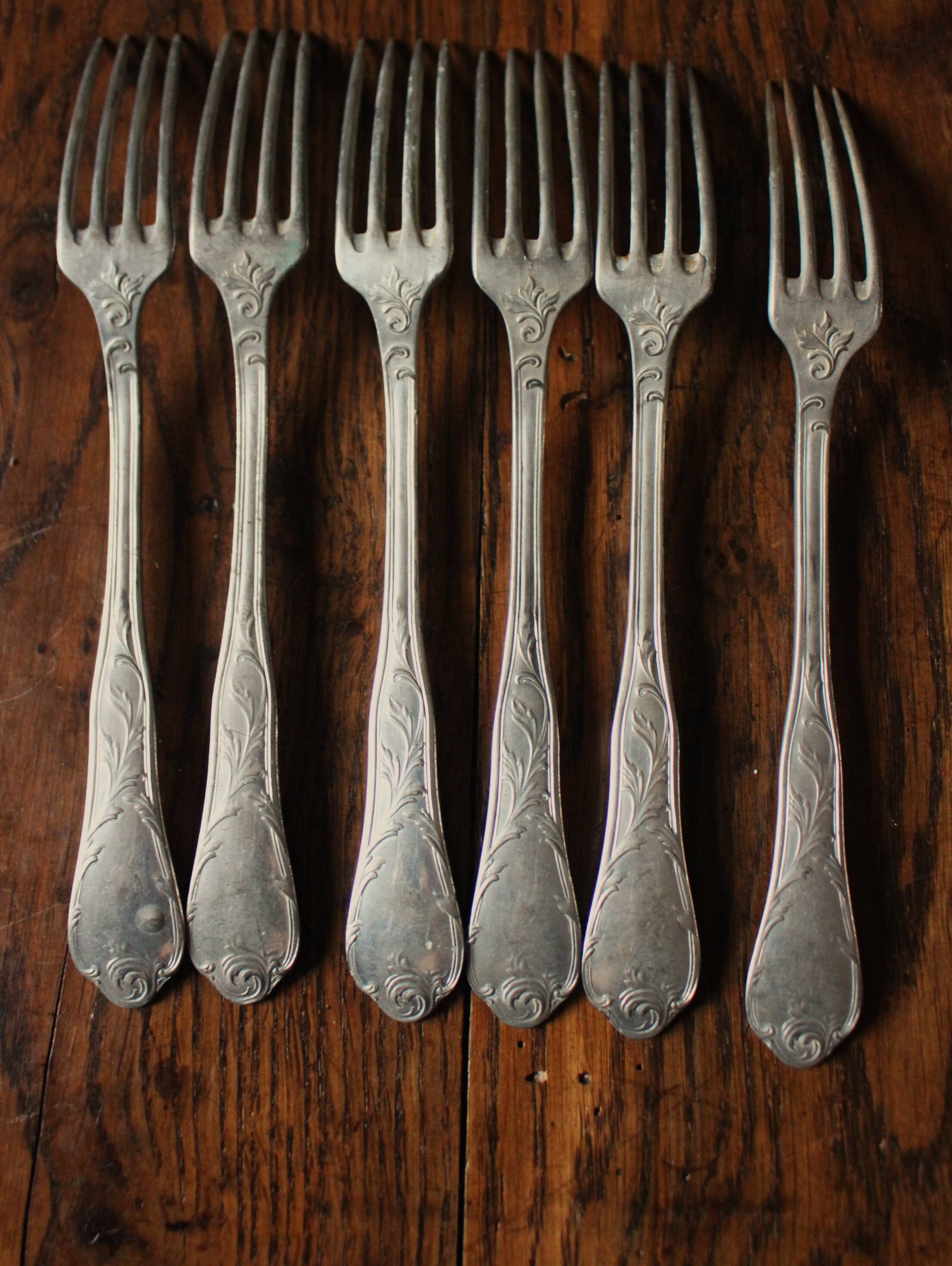 A set of 6 old flowered metal forks