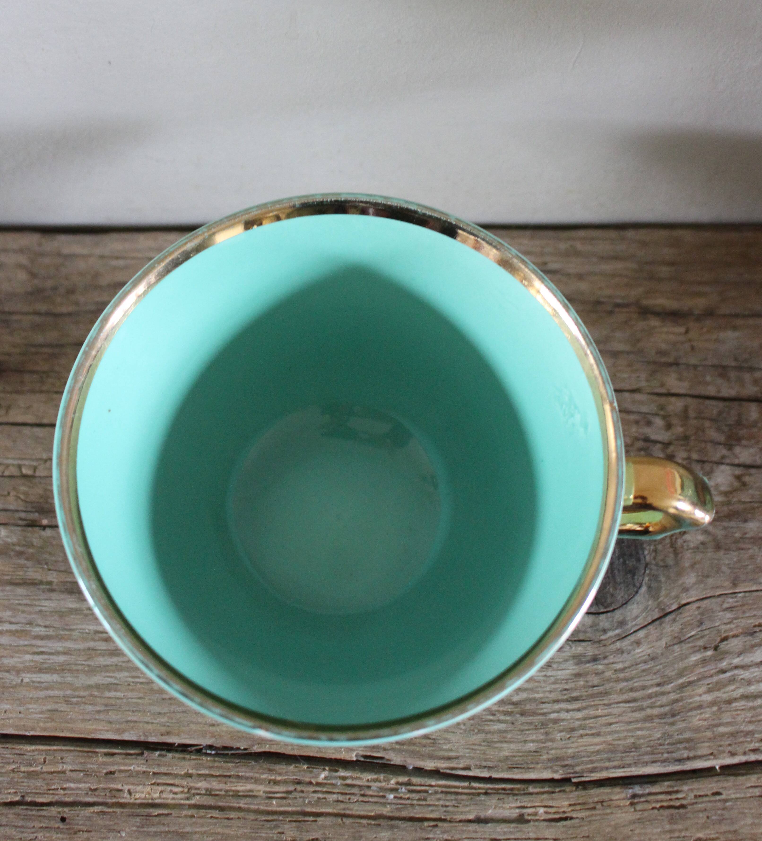 Green and gold cup from the Moi Salins collection.
