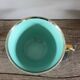 Green and gold cup from the Moi Salins collection.