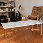 Vintage neoclassical coffee table in white marble and gold metal.