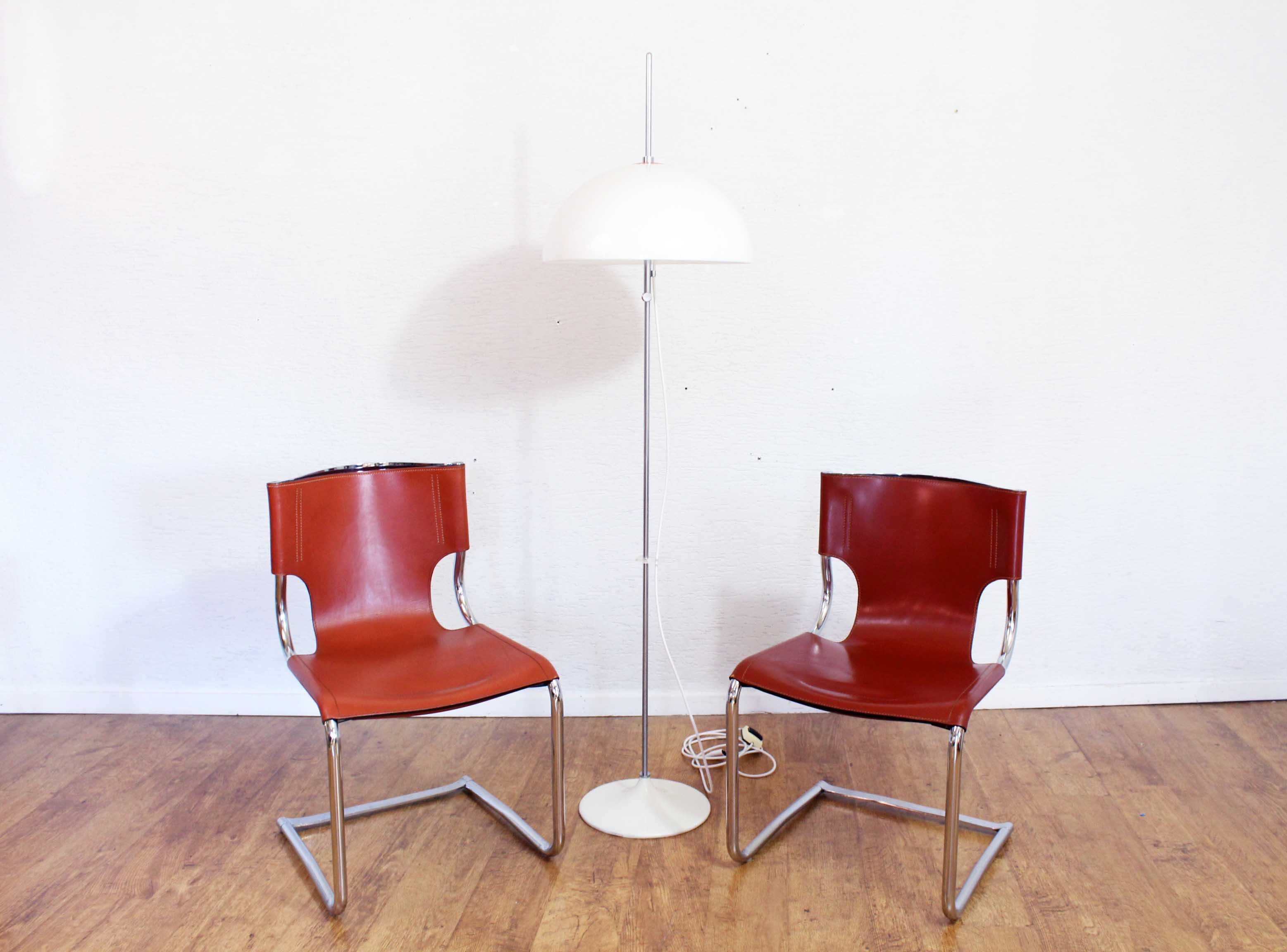 Pair of chairs in leather and chrome tube